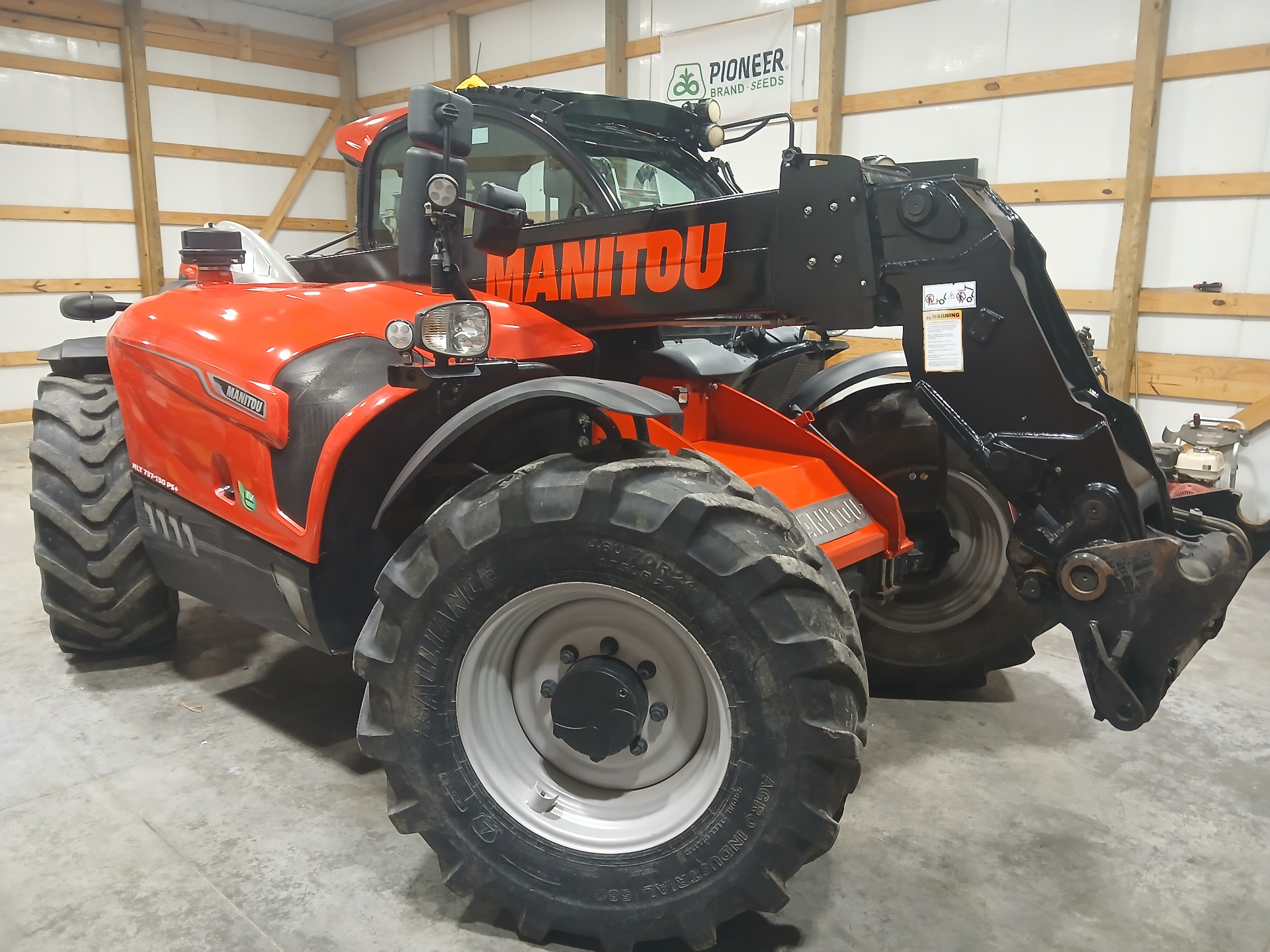 Manitou telehandler detailed inside a farm building