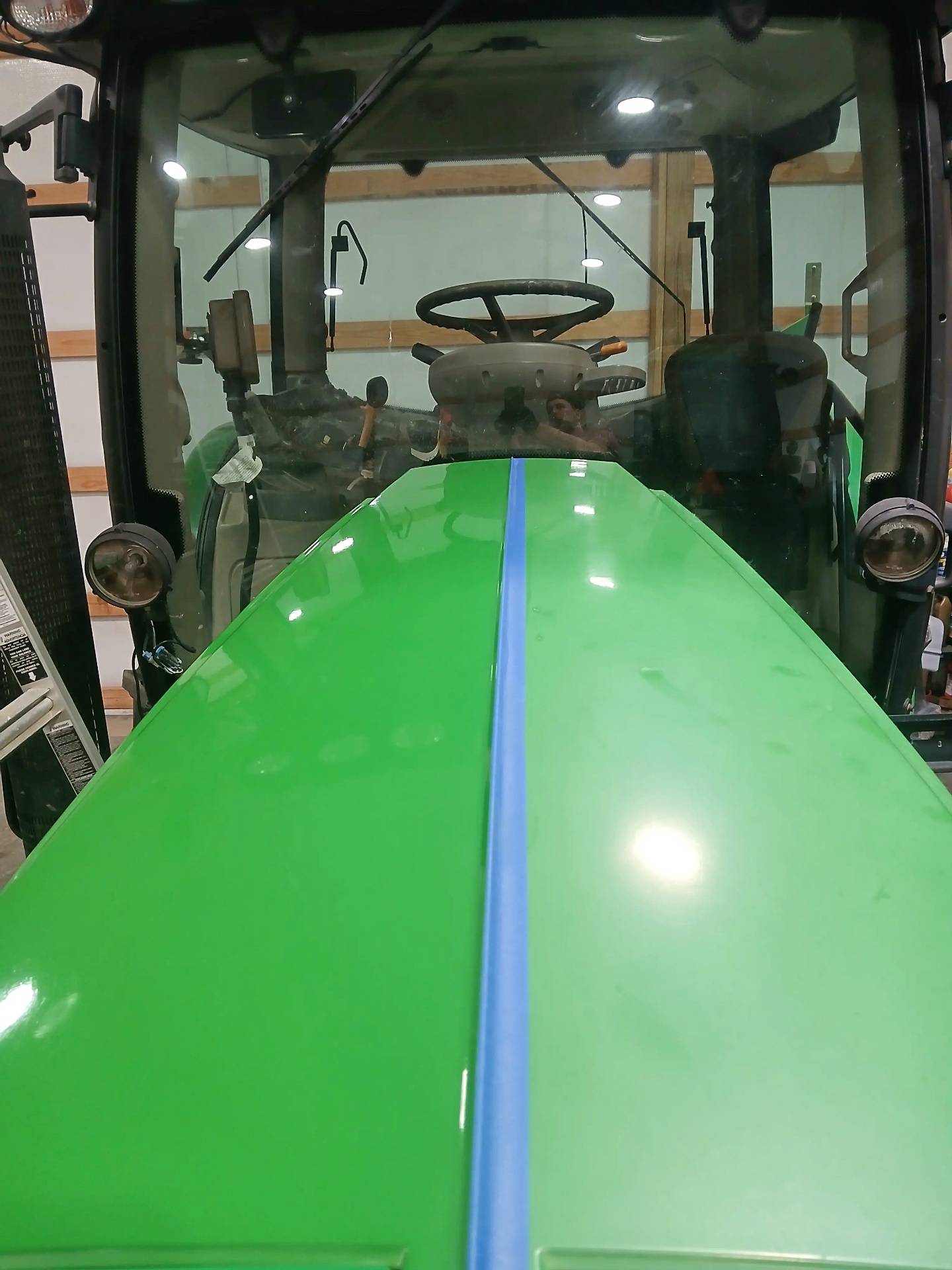 Front cab and hood of a cleaned and protected John Deere tractor