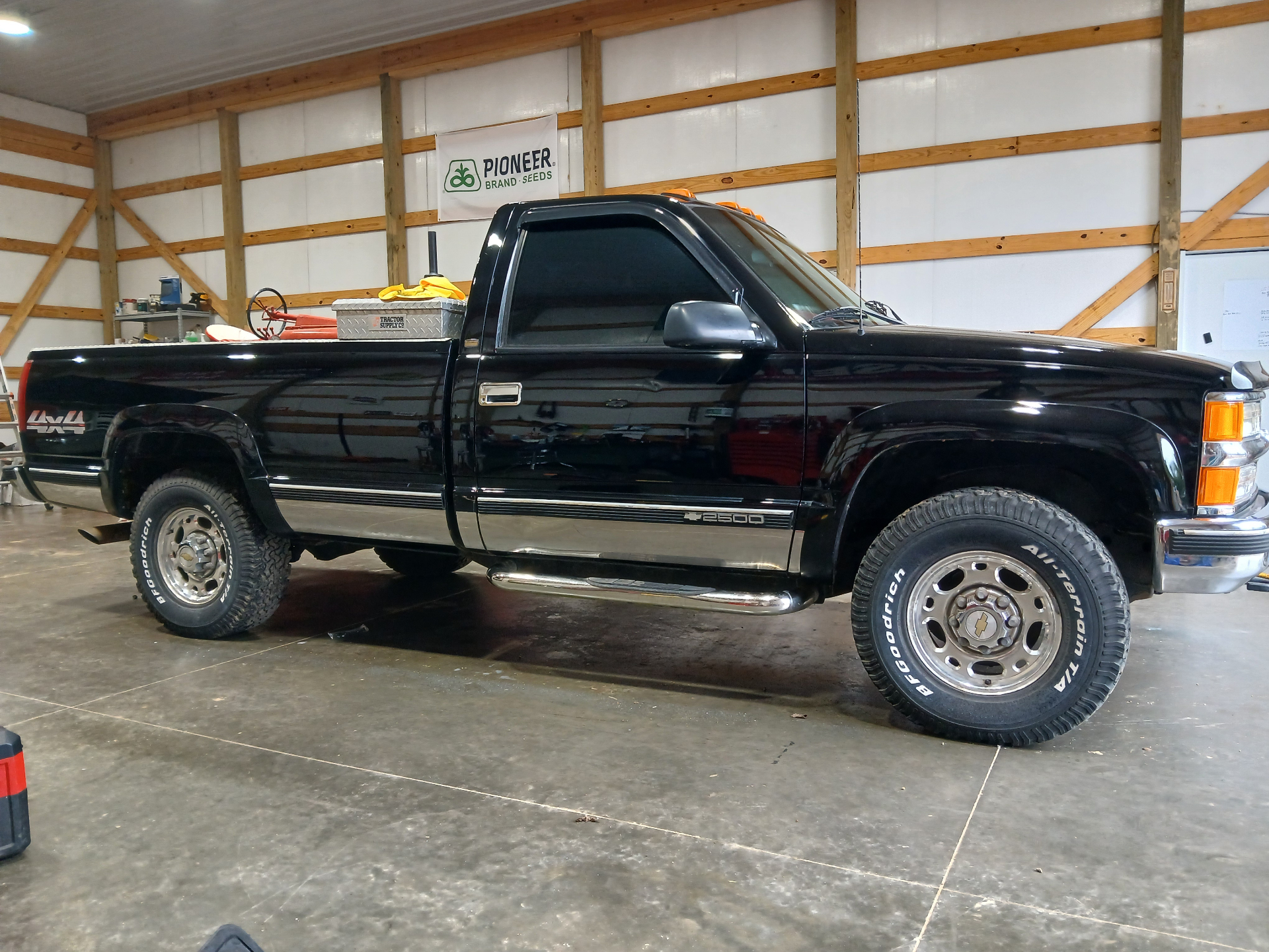 Black Chevy 2500 truck detailed with a deep gloss finish