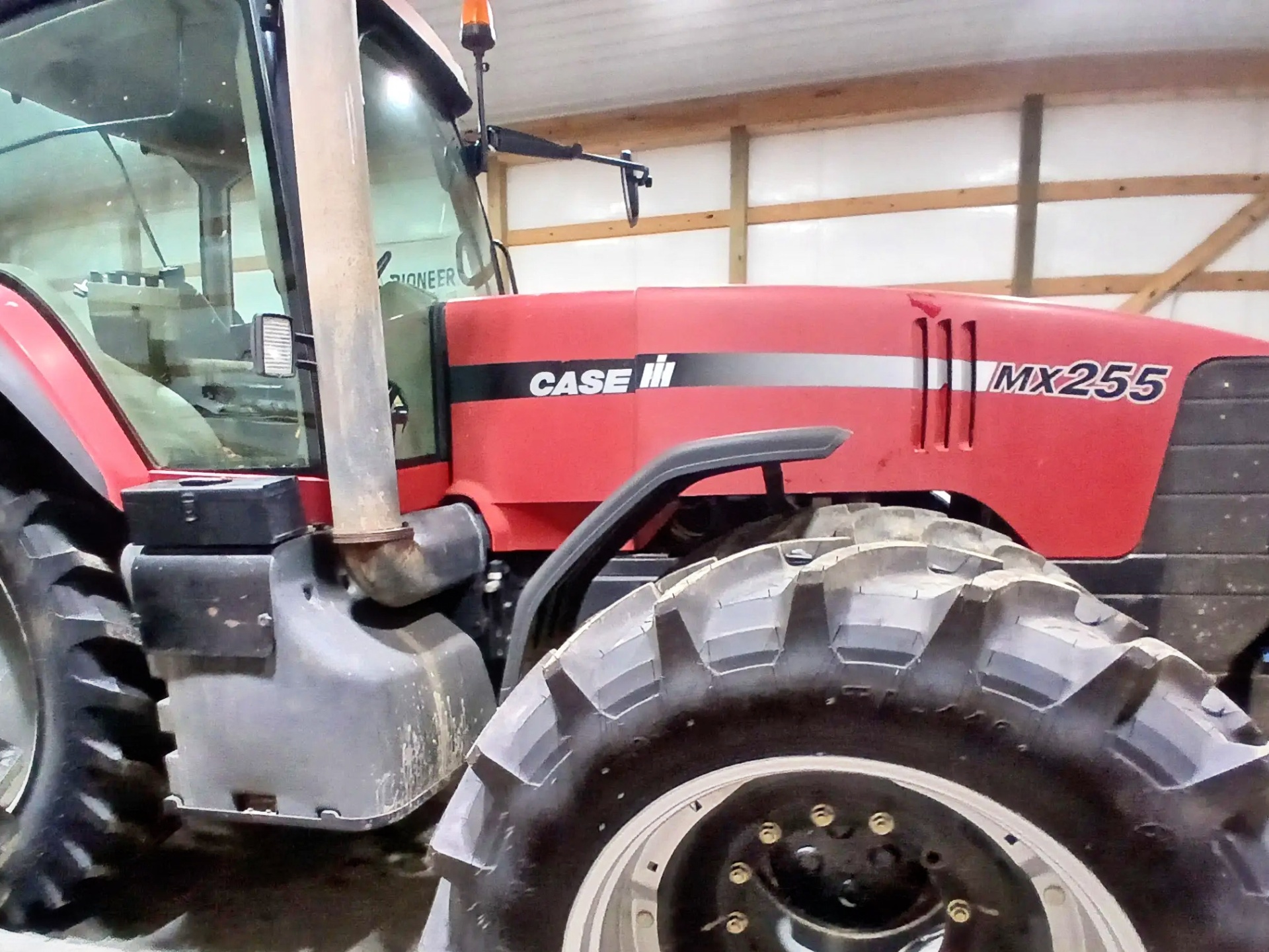 Before restoration view of faded Case IH MX255 paint